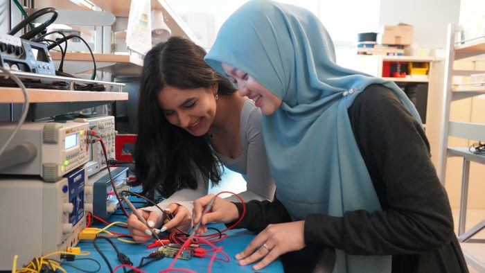 Two students work in the Computer Engineering lab at UBC Okanagan.