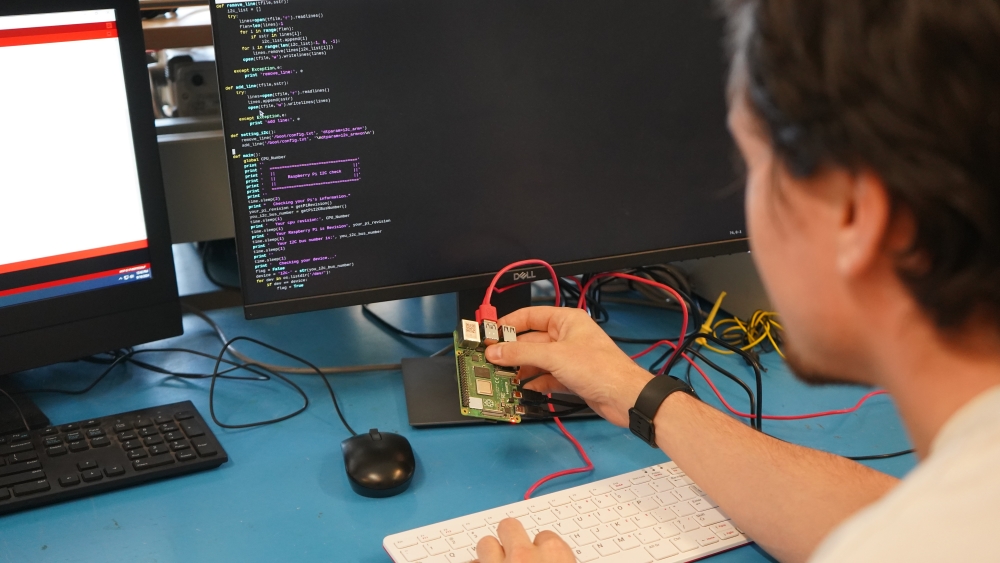 A student works with a RaspberryPi device in the computer engineering lab.