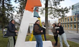 UBCO WiE paint the E to honour the 14 Not Forgotten